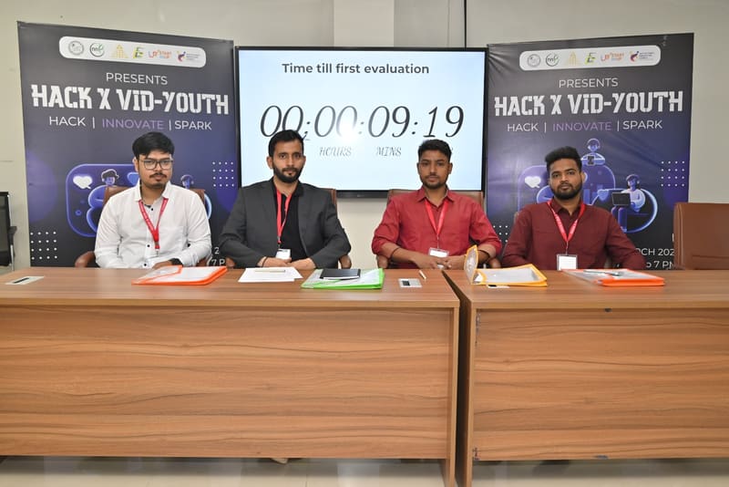 Evaluation panel seated ahead of the first assessment round at HACK X VID-YOUTH, IET Lucknow.